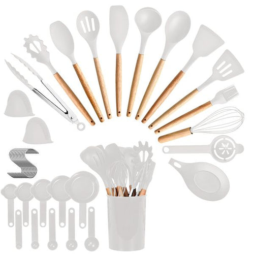 Thirty-five piece wood-handle kitchen utensil set standing in a holder
