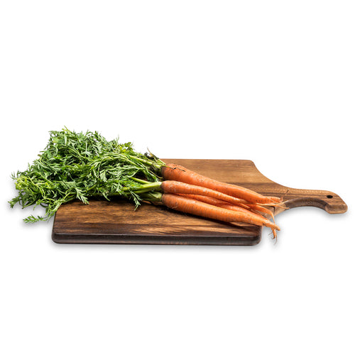 Large acacia wood serving board with handle, shown with fresh carrots (not included)