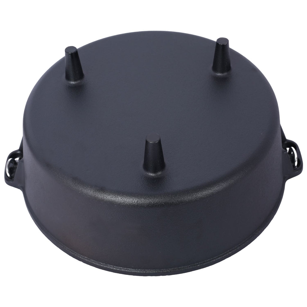 Underside of the cast iron Dutch oven showing its three legs